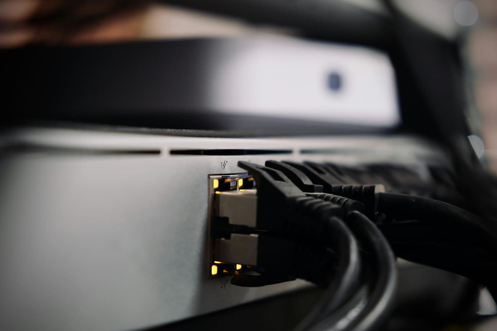 Network cables connected to the back of a device.
