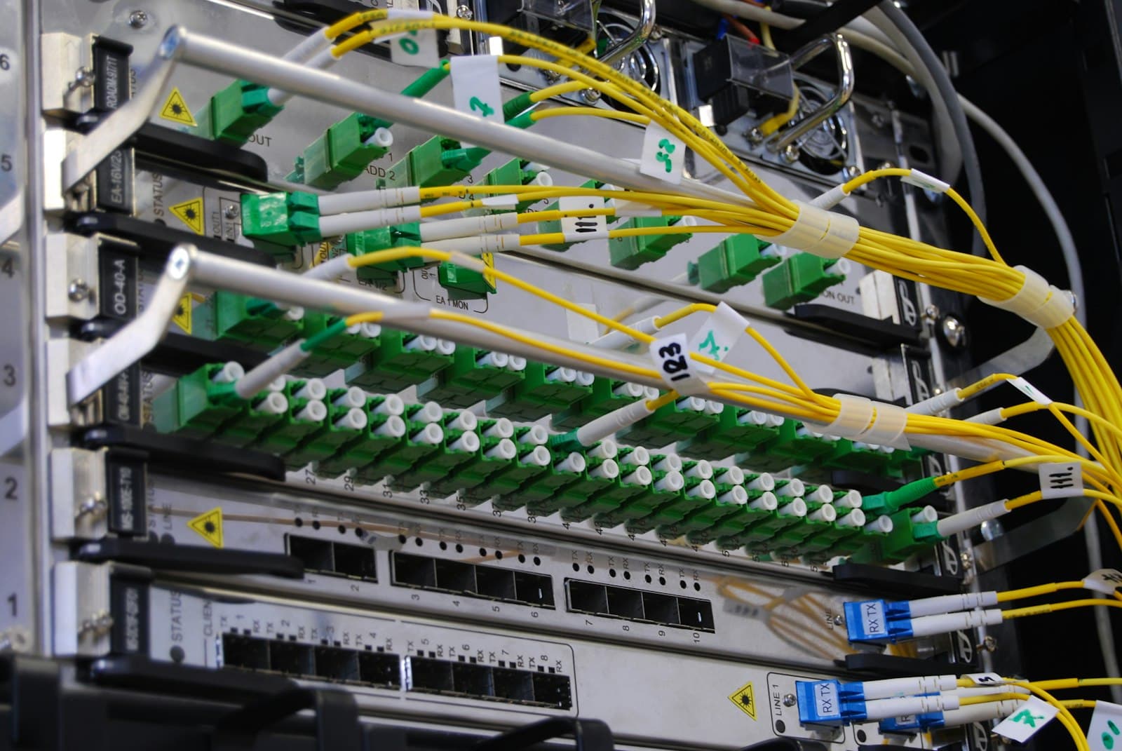Fibre-optic cables connected to a network switch.