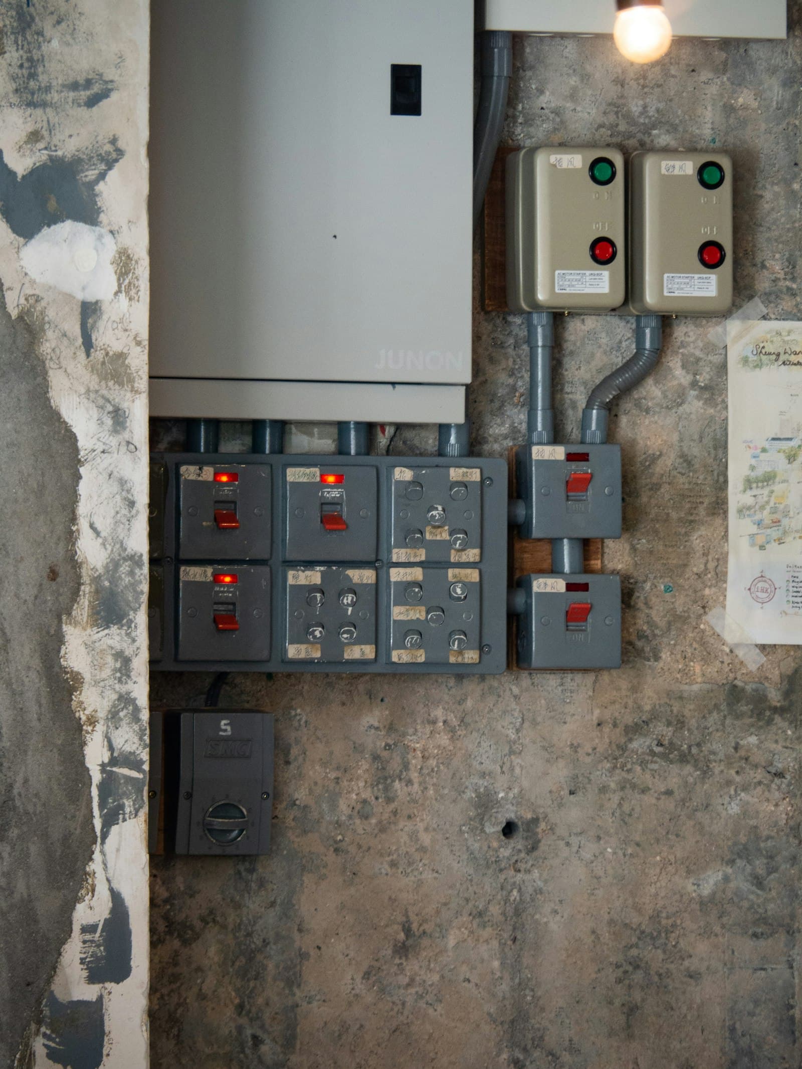 Industrial switchgear panel with switches and protection devices.
