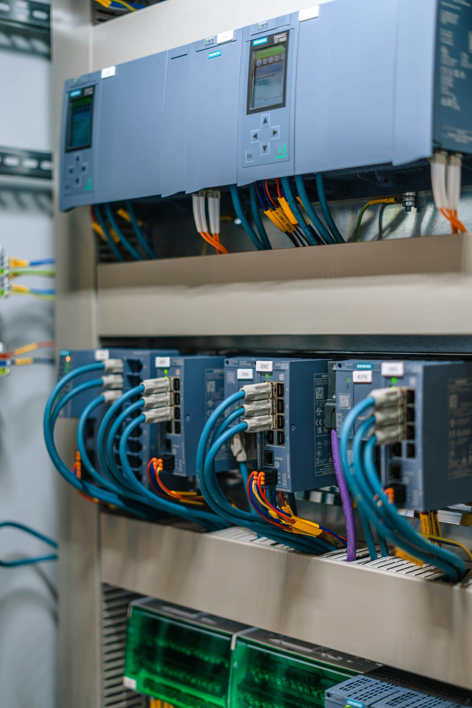 Variable-frequency drive modules wired in a control cabinet.