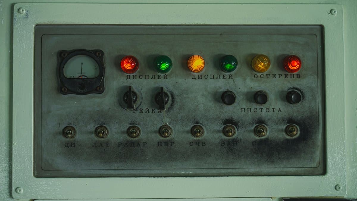 Alarm panel with indicator lamps and a meter.