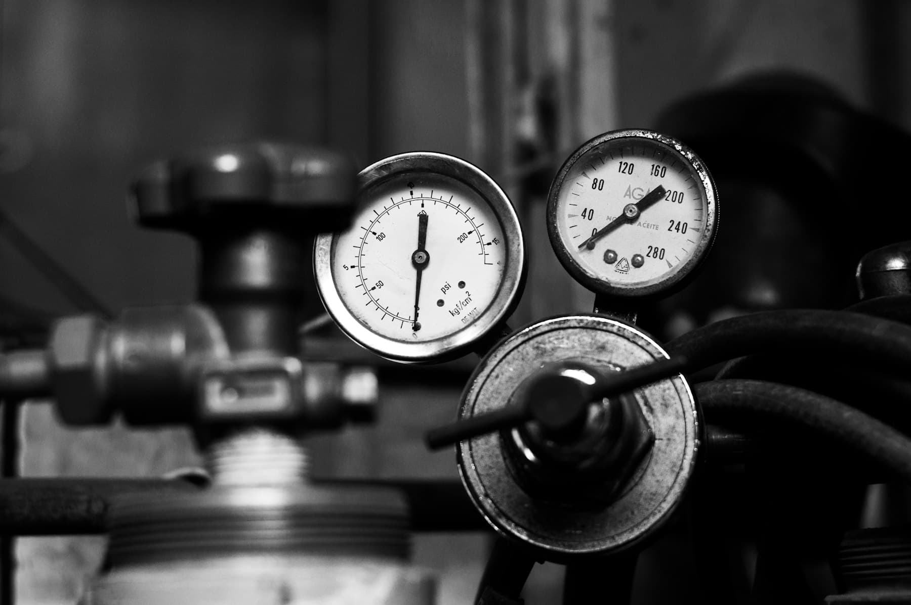 Pressure gauges and valves on process pipework.